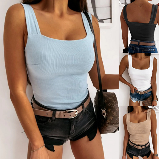 Woman wearing a light blue tank top and black shorts with a brown bag in different colors.
